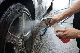 Hand washing a VW's tyres