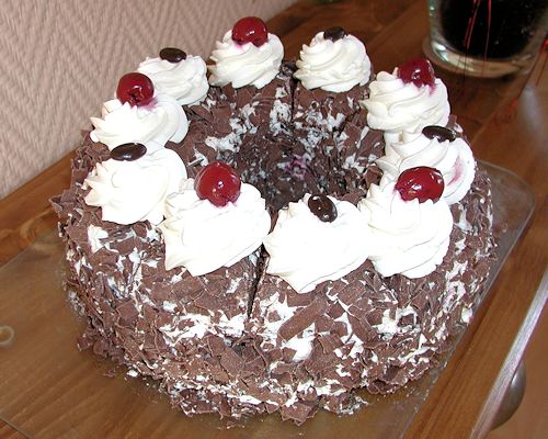 A cake decorated with Maraschino cherries