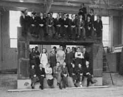 Scientific and technical staff of Berkeley laboratory standing on the magnet of a 60 inch cycltron (used without permission)