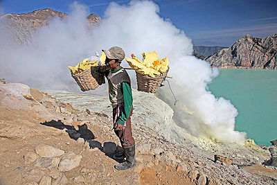 Sulfur miners in the volcano Kawah Ijen