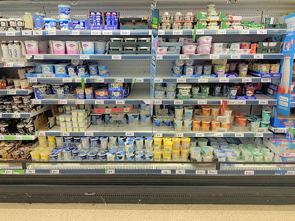Shop shelves selling dairy produce